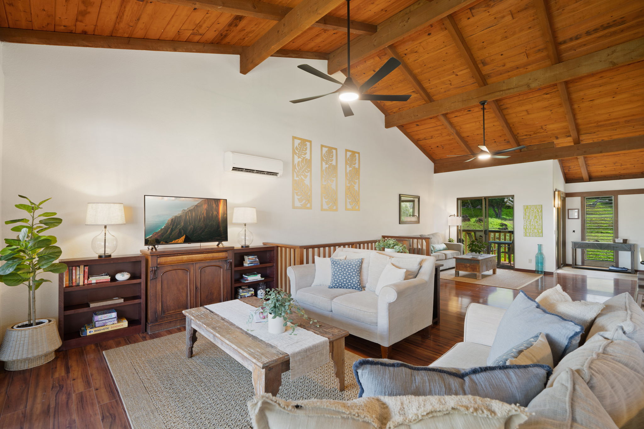 1870 Hoone Road, Unit 600 Koloa, HI 96756 - Photo 7 of 30 a living room with furniture and a flat screen tv
