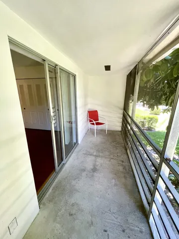 a view of a hallway with furniture