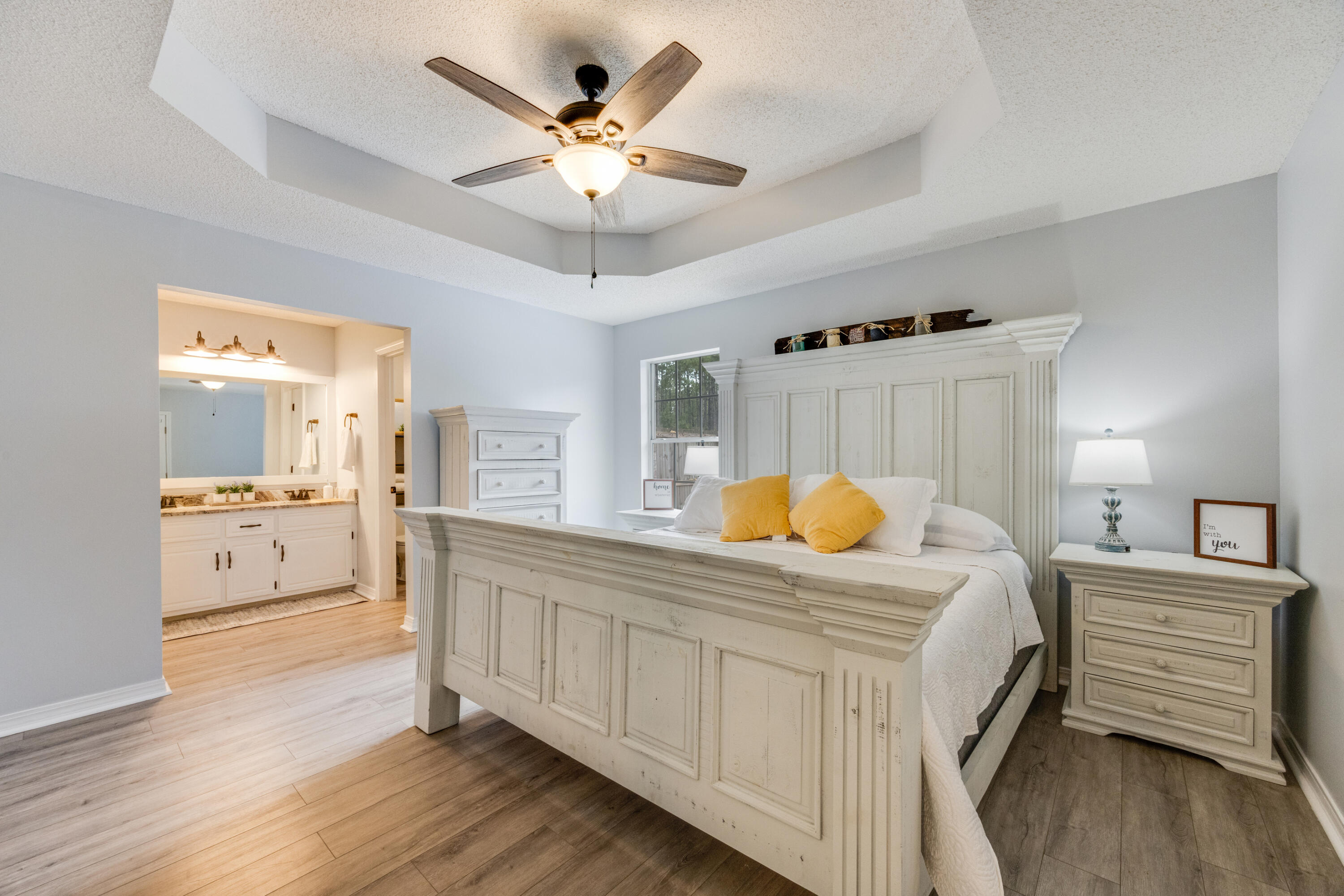 6090 Buckward Road Baker, FL 32531 - Photo 20 of 51 a bedroom with a bed and a chandelier