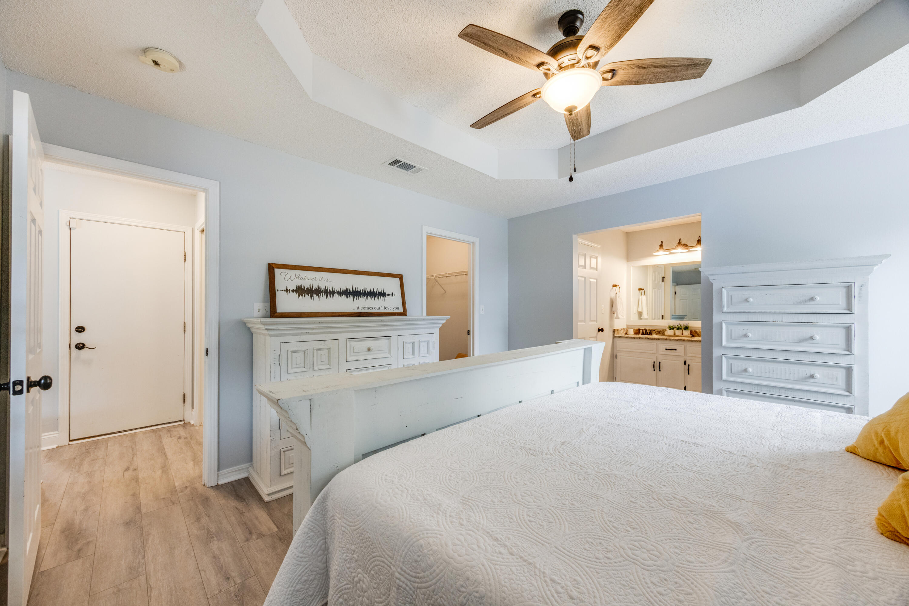 6090 Buckward Road Baker, FL 32531 - Photo 21 of 51 a bedroom with a bed and a chandelier