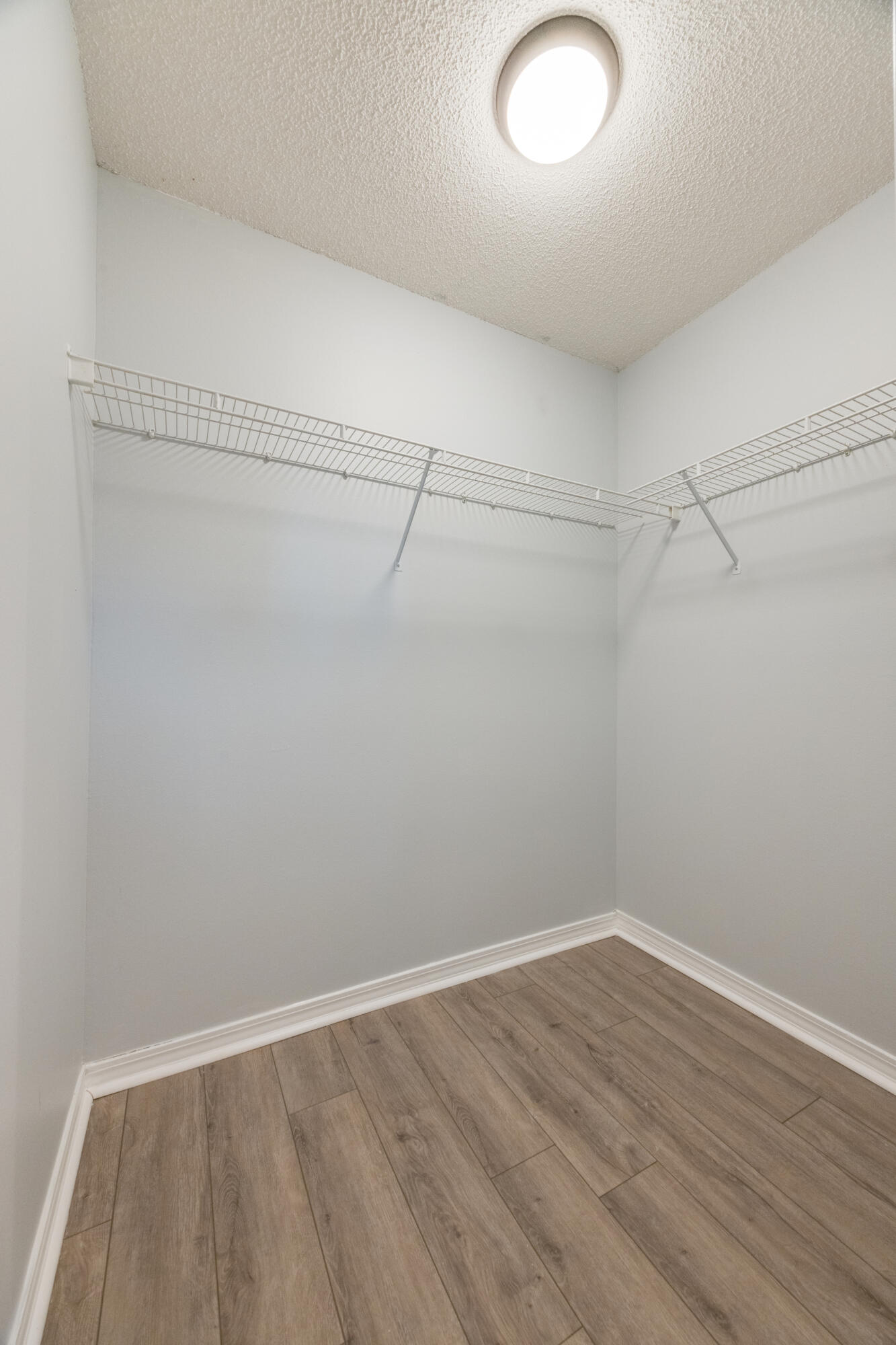 6090 Buckward Road Baker, FL 32531 - Photo 26 of 51 a view of a room with wooden floor and fan