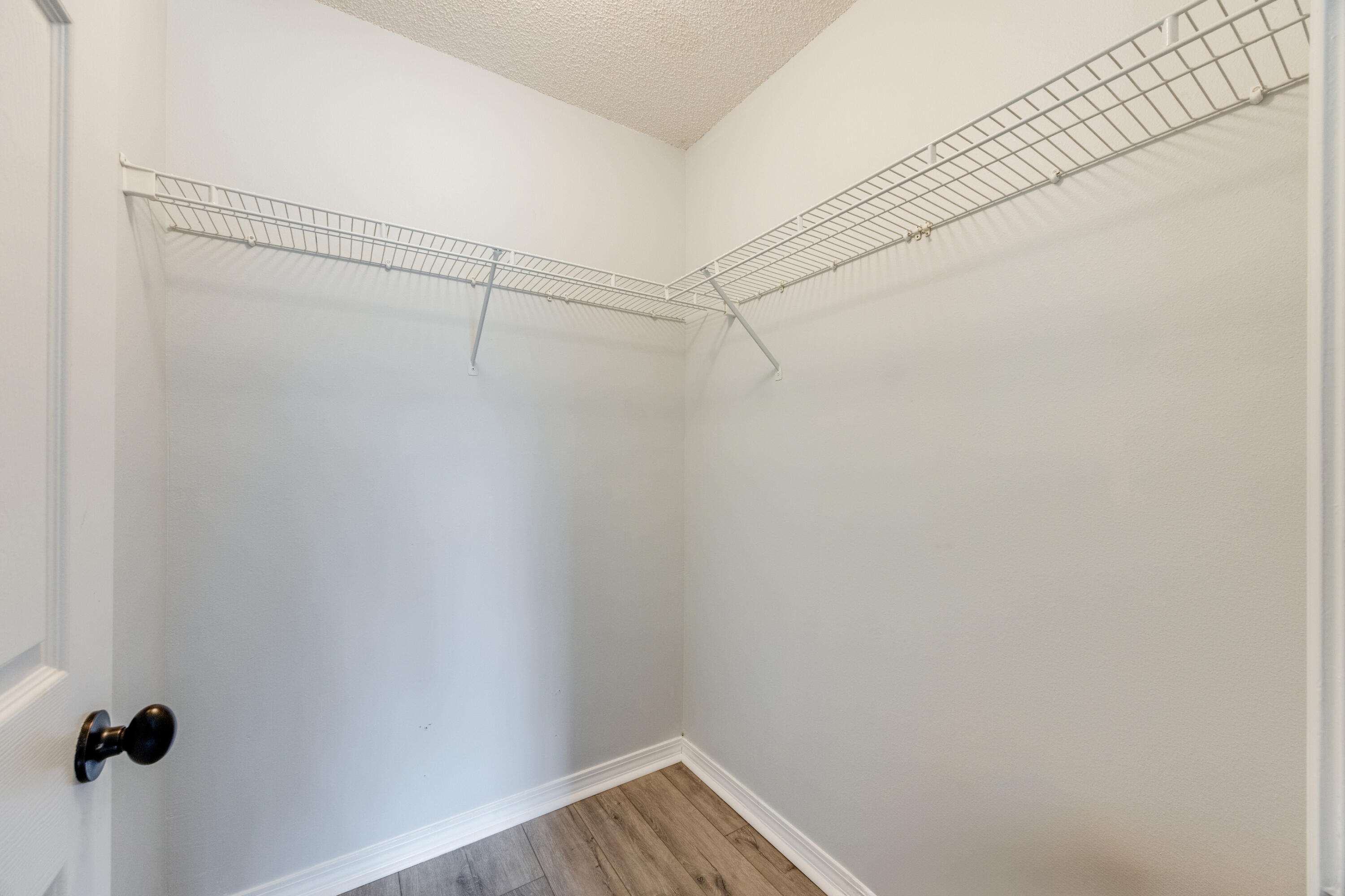 6090 Buckward Road Baker, FL 32531 - Photo 27 of 51 a view of a room with racks on the wall