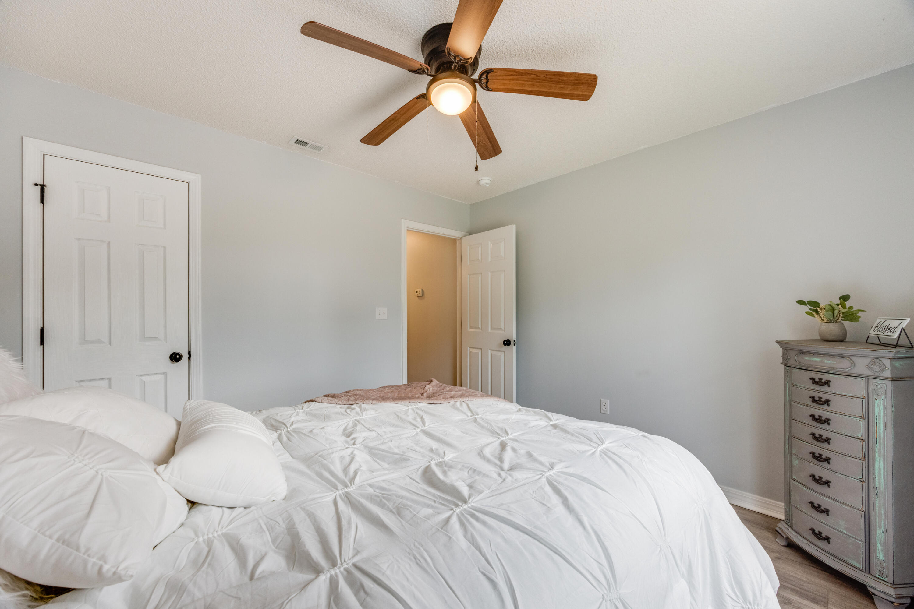 6090 Buckward Road Baker, FL 32531 - Photo 29 of 51 a bedroom with a bed and a dresser