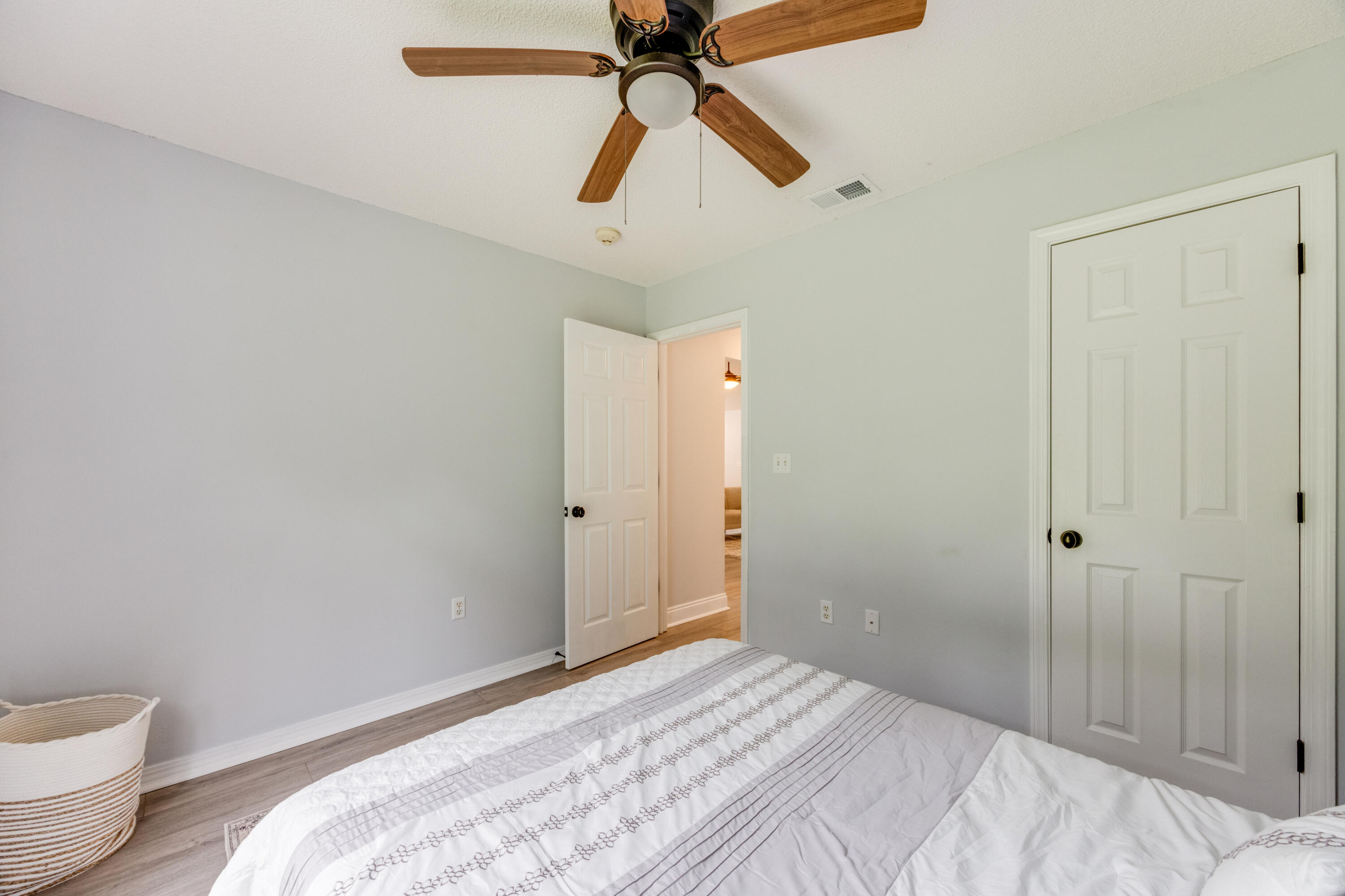 6090 Buckward Road Baker, FL 32531 - Photo 31 of 51 a bedroom with a bed and a chandelier