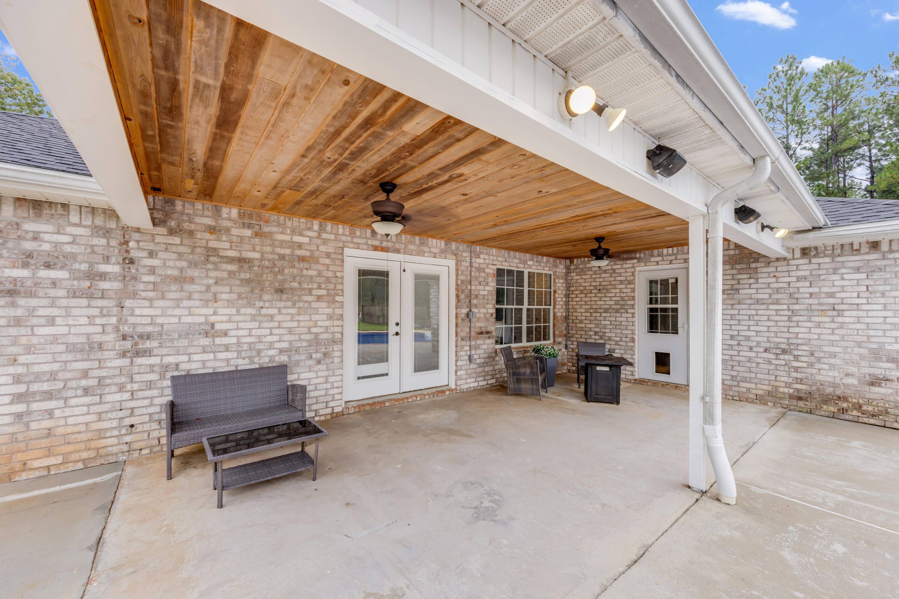 6090 Buckward Road Baker, FL 32531 - Photo 35 of 51 a view of a patio with table and chairs and potted plants