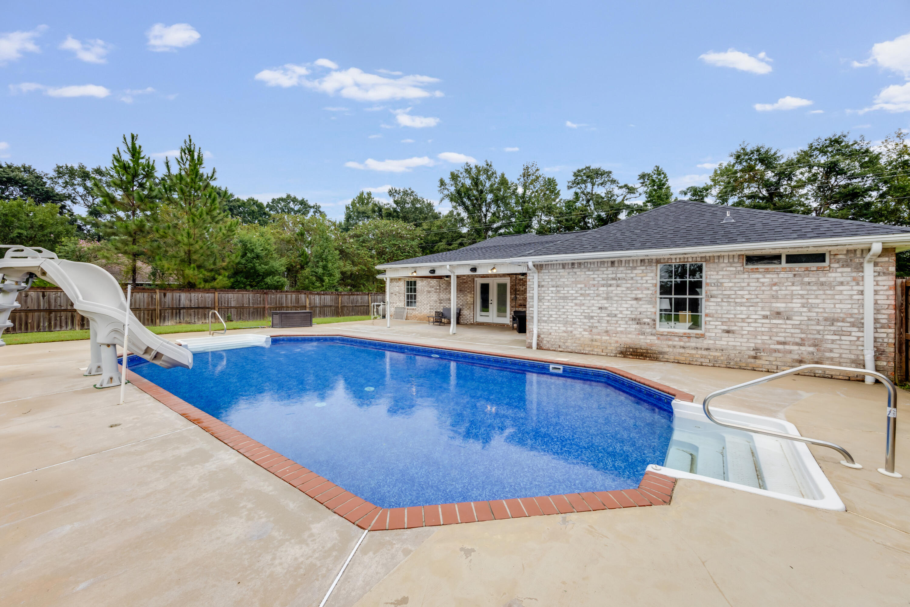 6090 Buckward Road Baker, FL 32531 - Photo 37 of 51 swimming pool view with a garden space