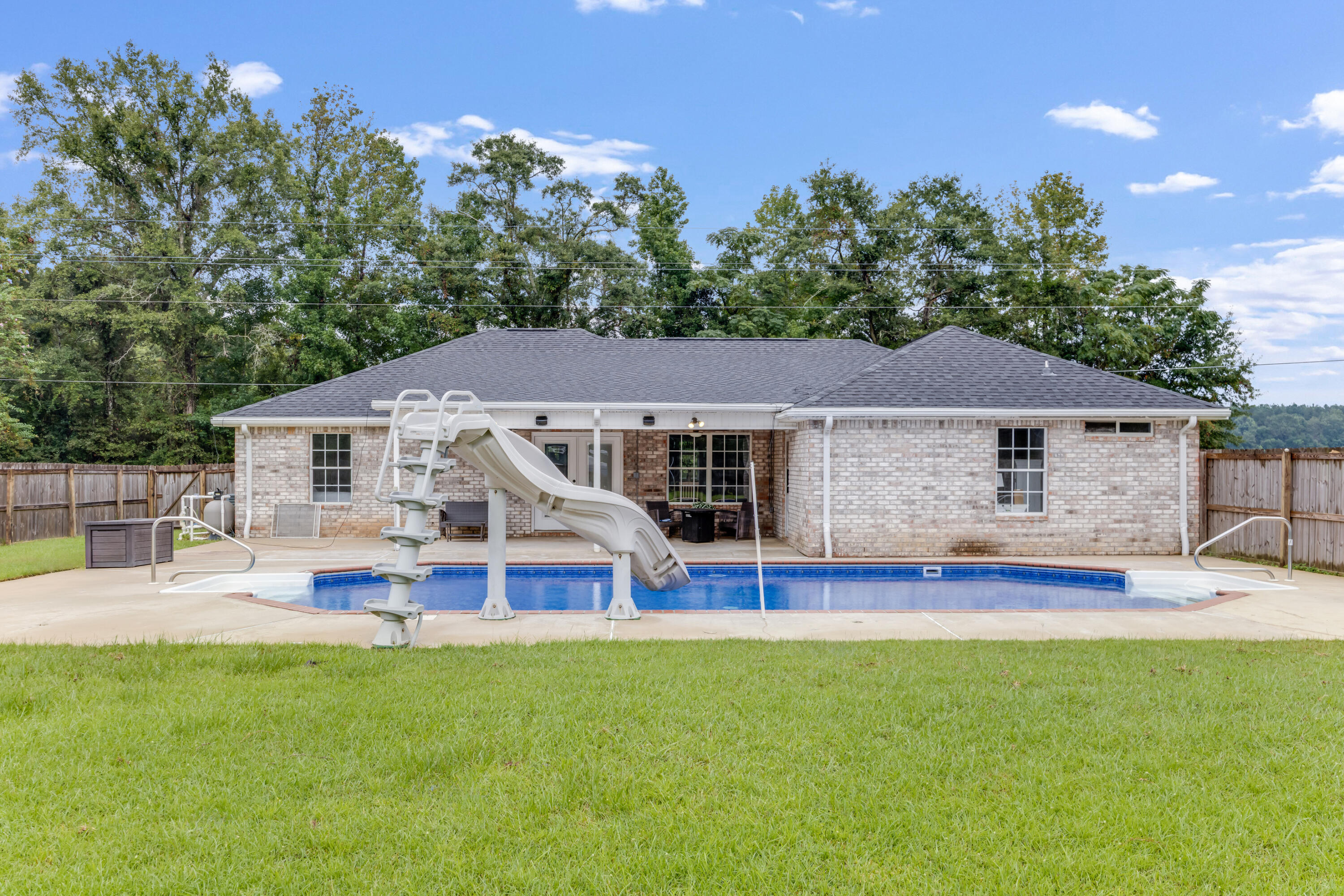 6090 Buckward Road Baker, FL 32531 - Photo 45 of 51 a front view of house with yard and outdoor seating