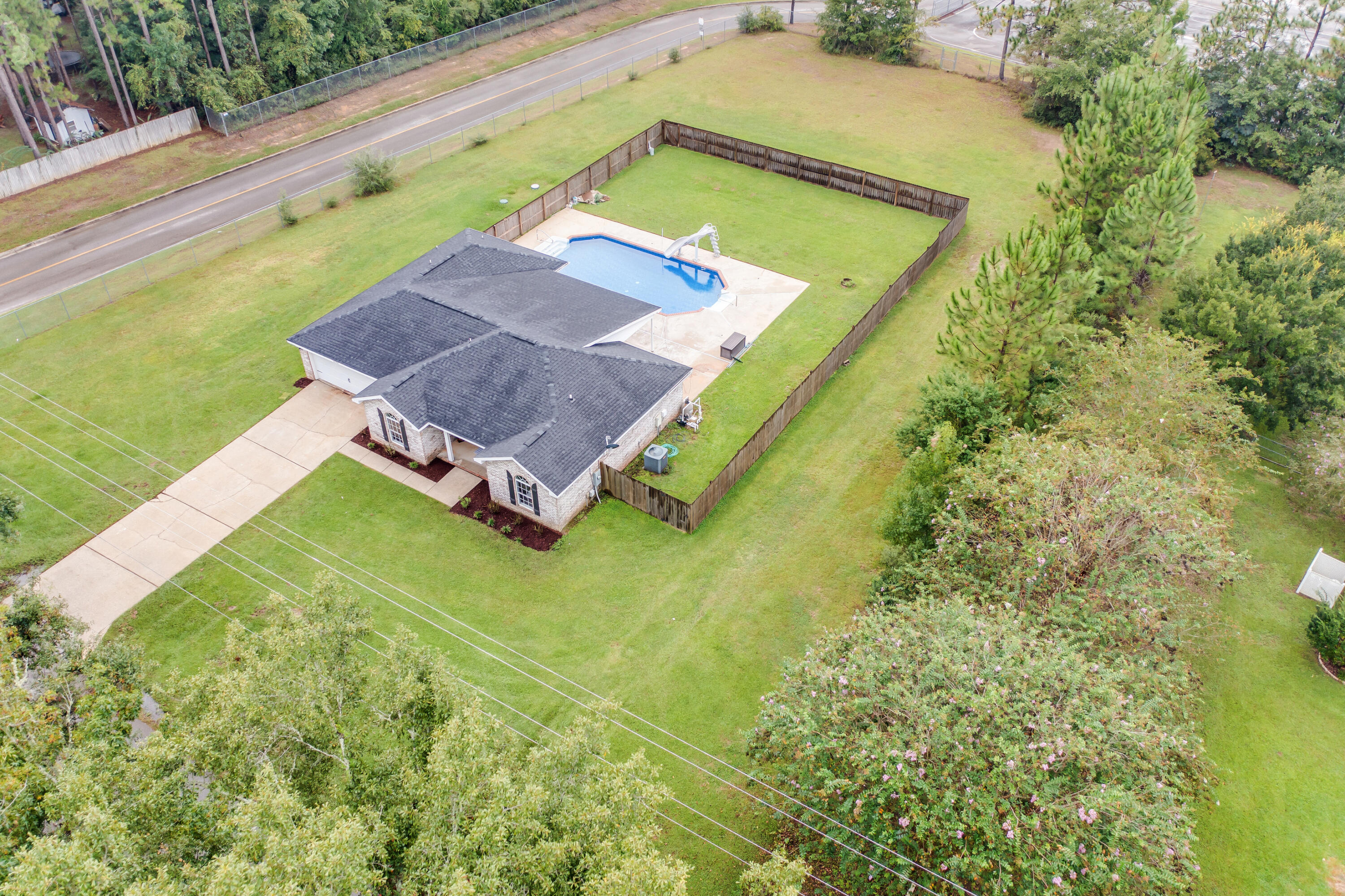 6090 Buckward Road Baker, FL 32531 - Photo 47 of 51 a view of an outdoor space with a swimming pool