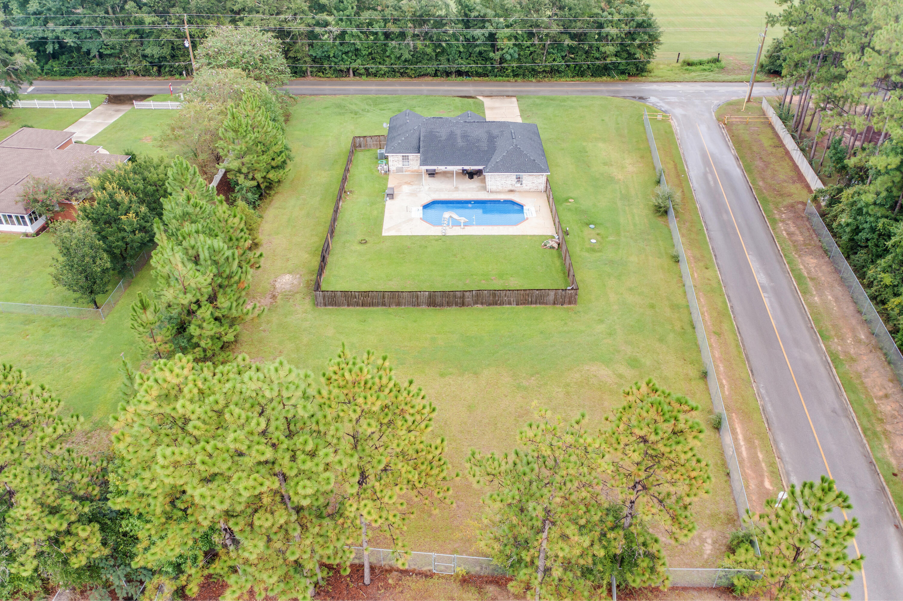 6090 Buckward Road Baker, FL 32531 - Photo 48 of 51 a view of a swimming pool with a yard
