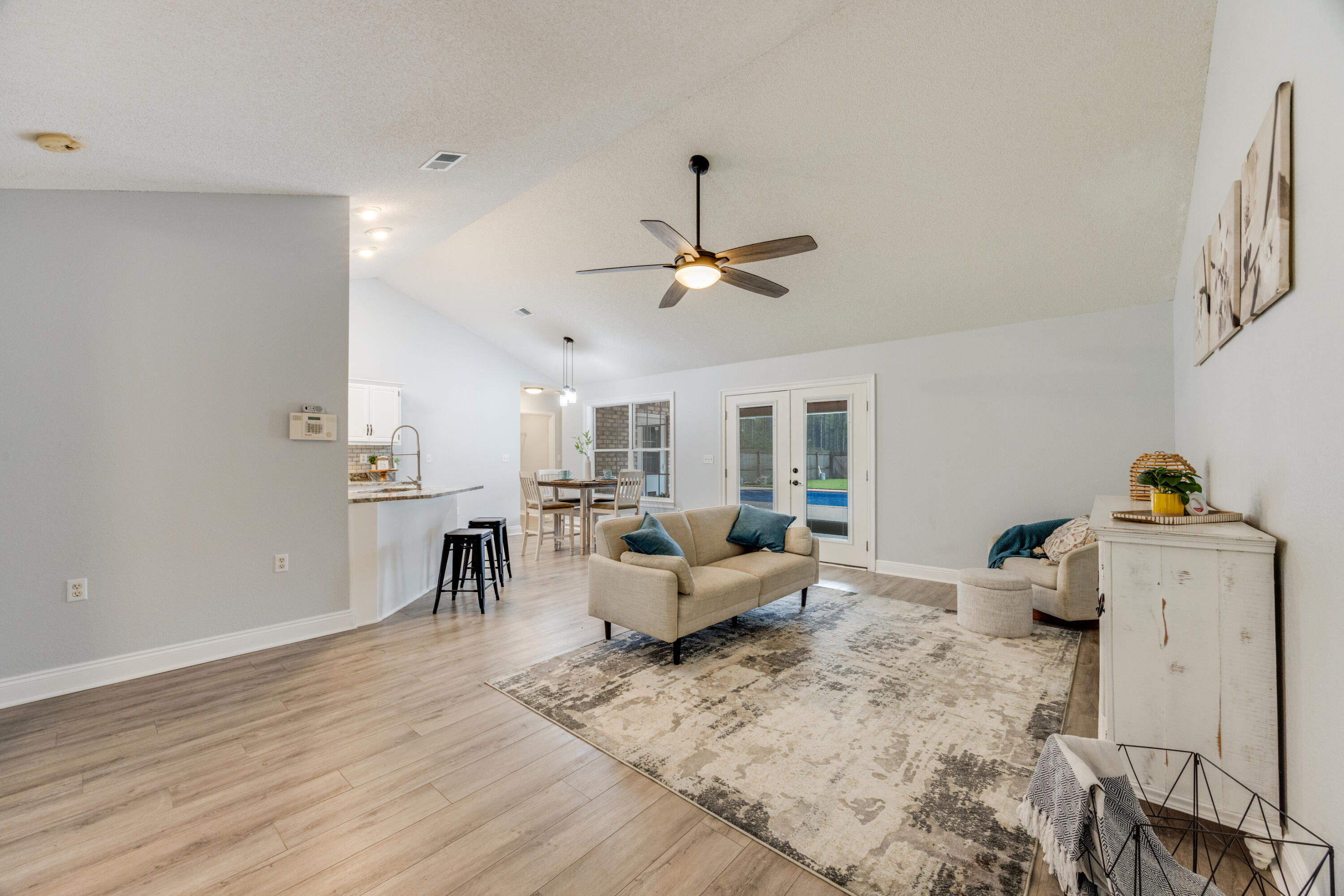 6090 Buckward Road Baker, FL 32531 - Photo 5 of 51 a living room with furniture and a chandelier