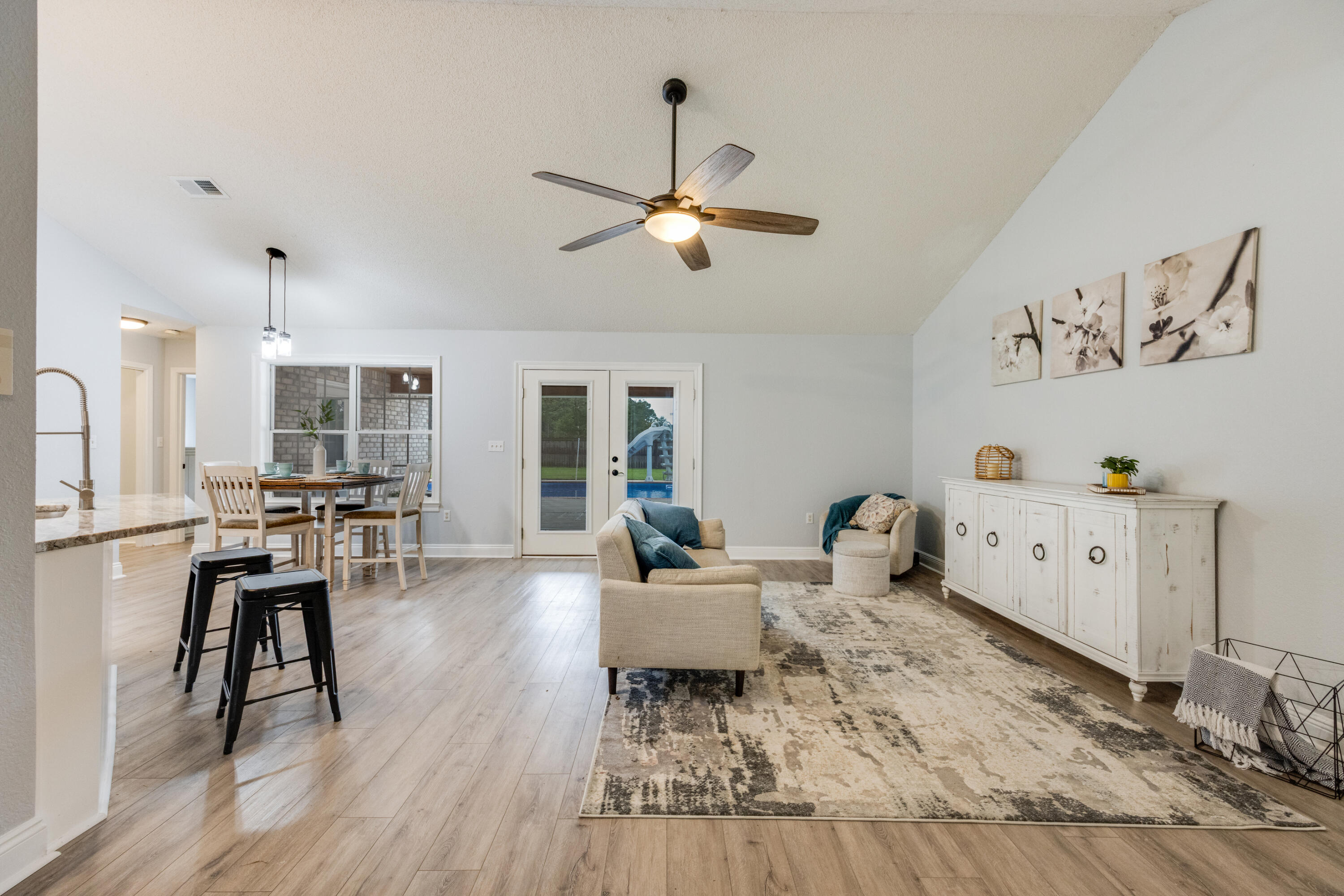 6090 Buckward Road Baker, FL 32531 - Photo 6 of 51 a living room with furniture and wooden floor