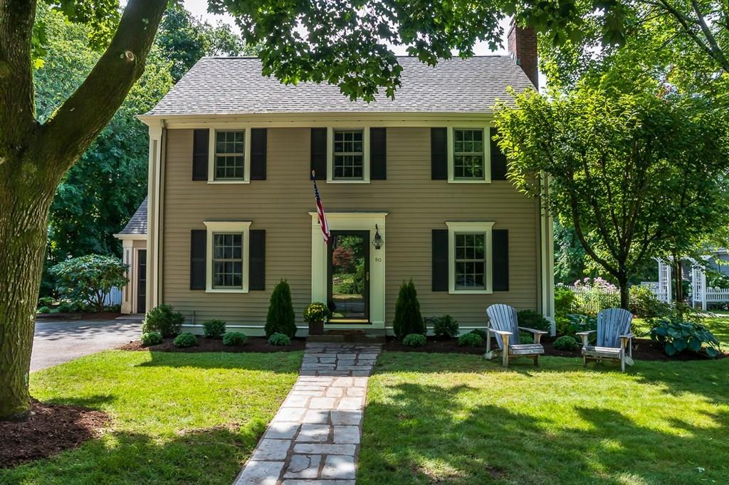 80 Mayo Road Wellesley, MA 02482 - Photo 1 of 22 a front view of a house with yard and green space