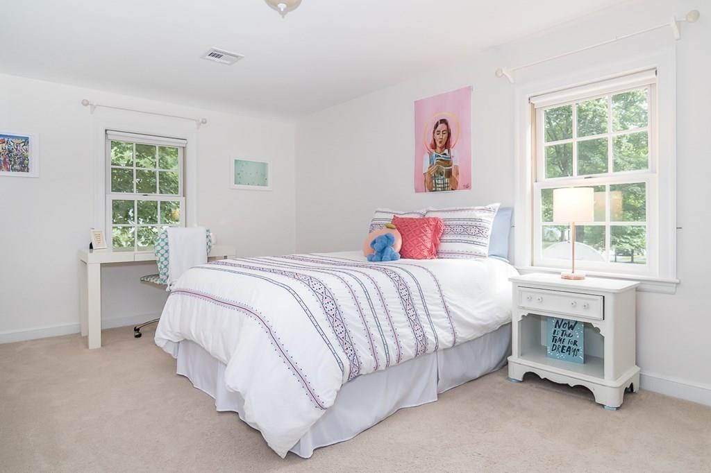 80 Mayo Road Wellesley, MA 02482 - Photo 13 of 22 a spacious bedroom with a bed and a window