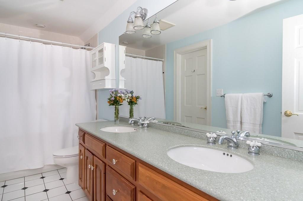 80 Mayo Road Wellesley, MA 02482 - Photo 14 of 22 a bathroom with a sink double vanity and a mirror