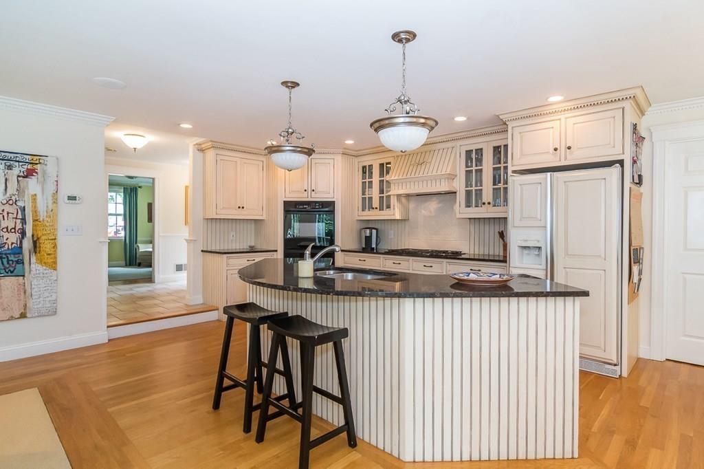 80 Mayo Road Wellesley, MA 02482 - Photo 2 of 22 a kitchen with stainless steel appliances granite countertop counter space a sink refrigerator and cabinets