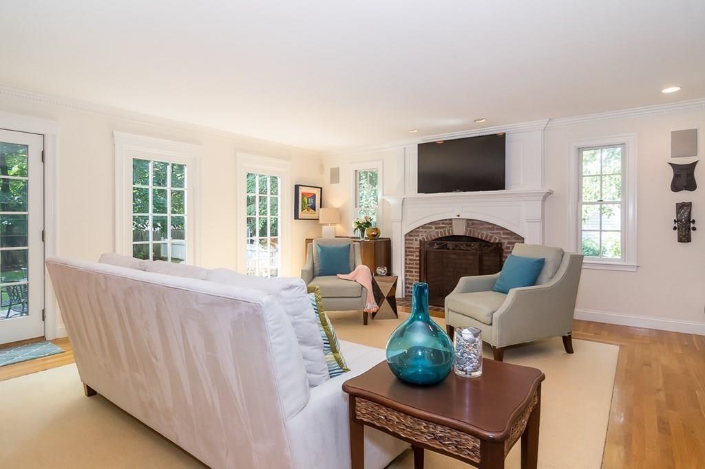 80 Mayo Road Wellesley, MA 02482 - Photo 5 of 22 a living room with furniture a fireplace and a flat screen tv