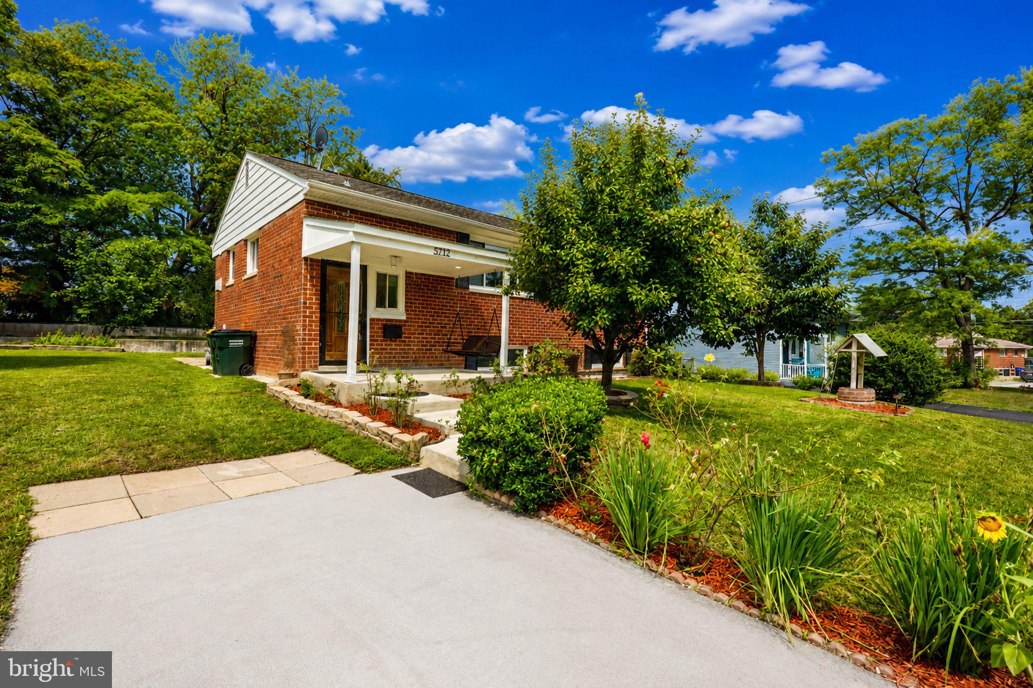 5712 Ash Drive Springfield, VA 22150 - Photo 38 of 38 Charming brick home with lush greenery.