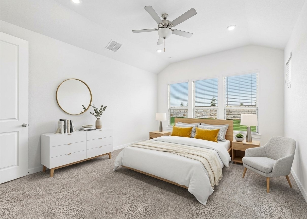 408 Brandywine Road Hutto, TX 78634 - Photo 11 of 13 Plentiful natural light streams through multiple windows into this carpeted bedroom with vaulted ceilings.
