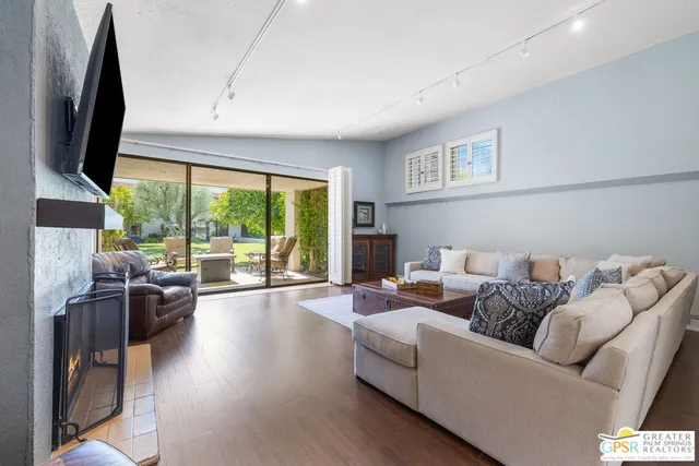 a living room with furniture and a large window