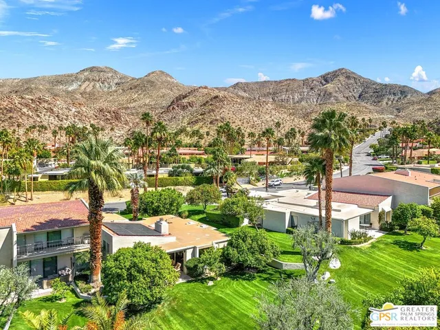 a view of a city with mountains in the background