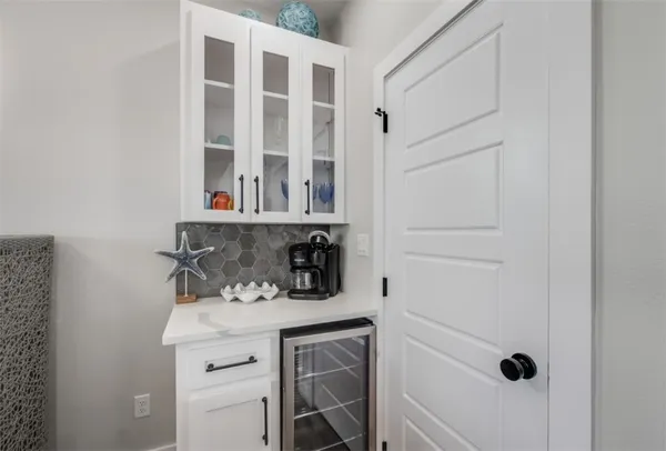 a view of a dining room with furniture wooden floor and chandelier