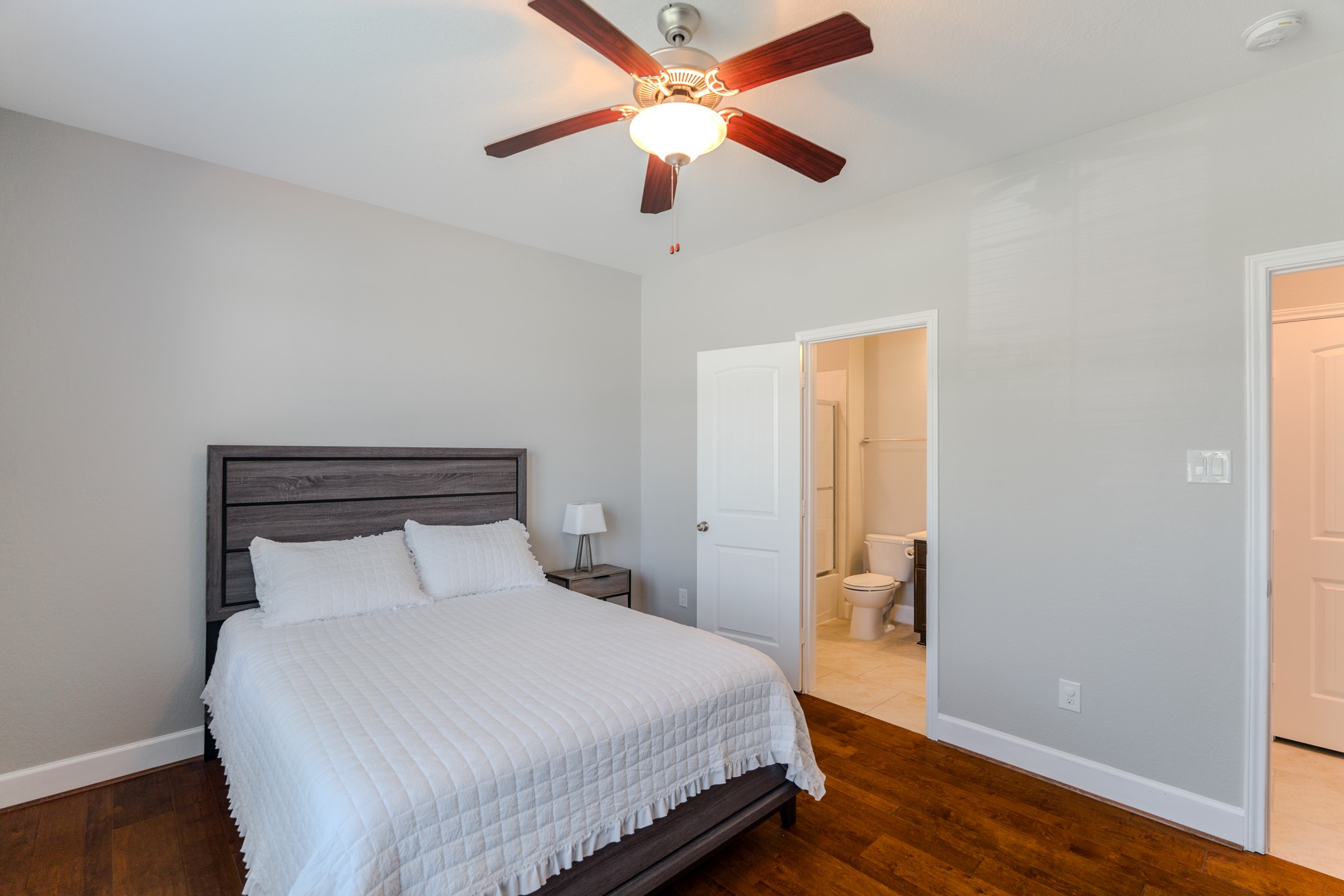 24322 North Newcastle Bay Trail Spring, TX 77389 - Photo 41 of 50 a bedroom with a bed and a ceiling fan