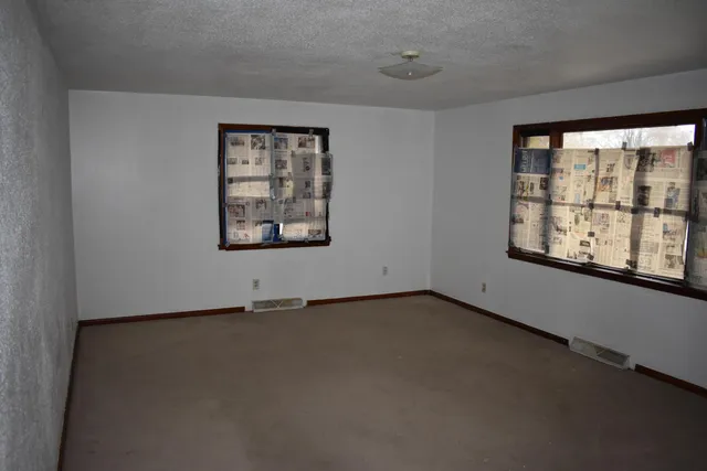 an empty room with windows