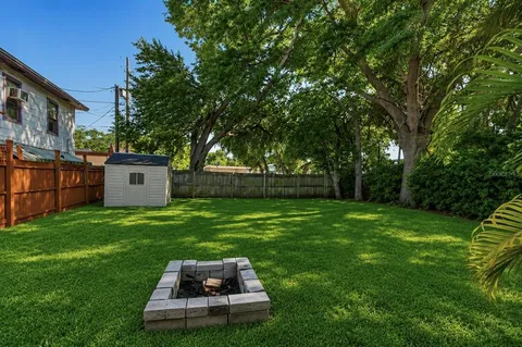 a view of a back yard of a house