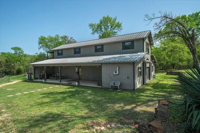 a front view of a house with yard