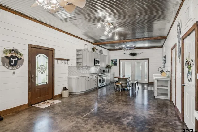 a kitchen with stainless steel appliances granite countertop lots of counter top space