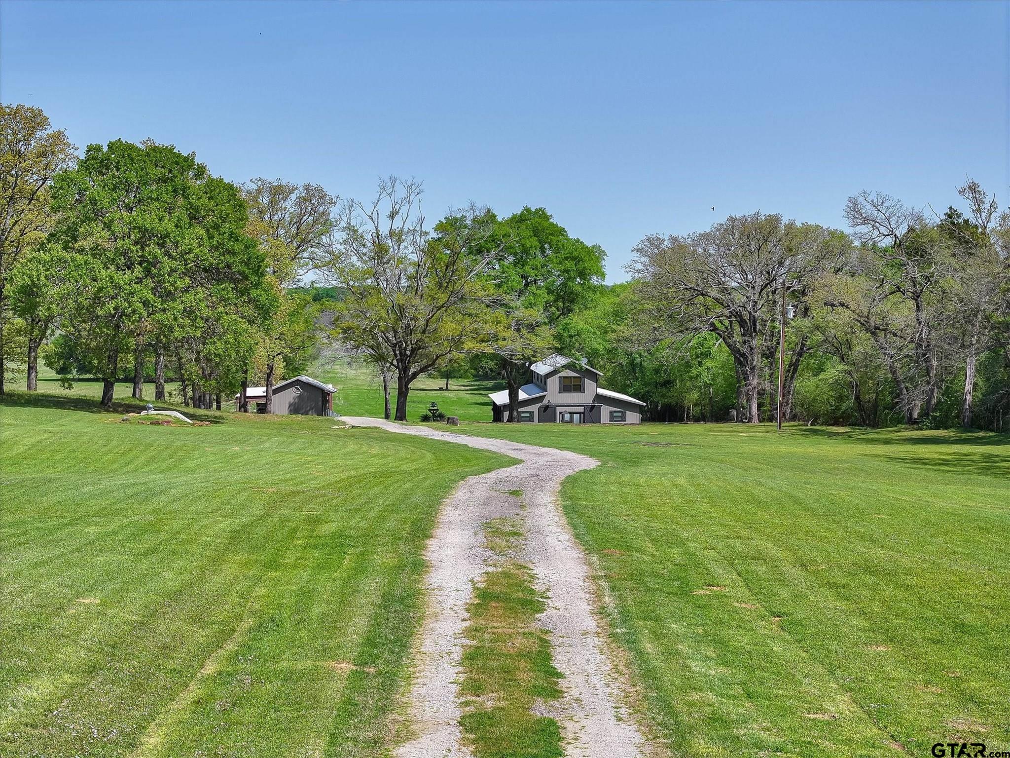 902 County Road 3710 Edgewood, TX 75117 - Photo 2 of 41 a view of a park with large trees