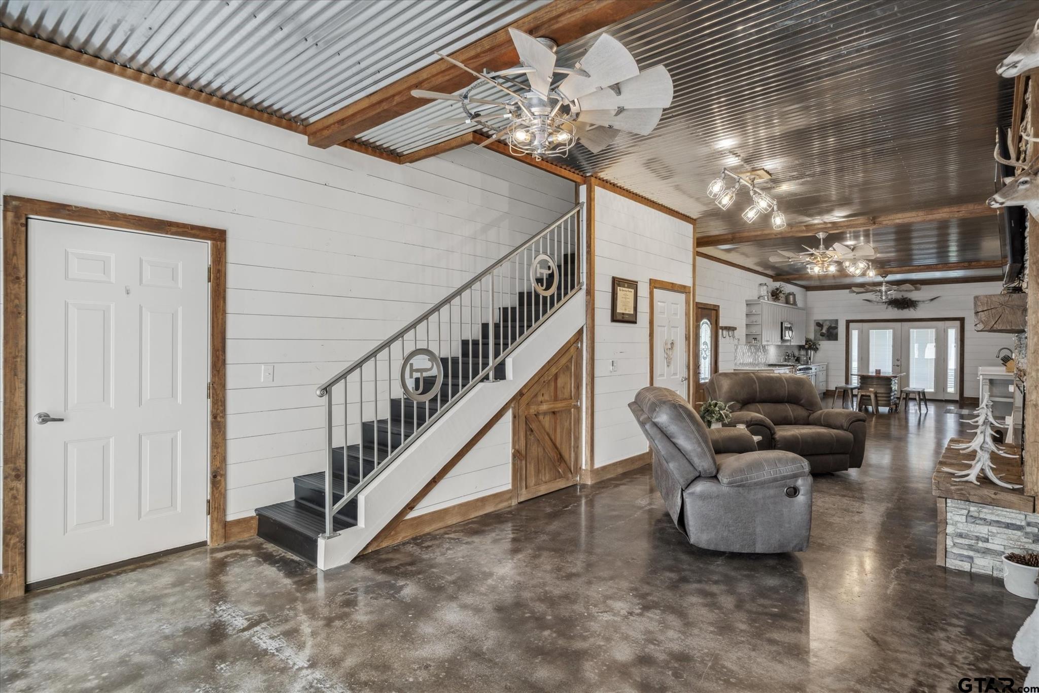 902 County Road 3710 Edgewood, TX 75117 - Photo 28 of 41 a living room with furniture and a chandelier