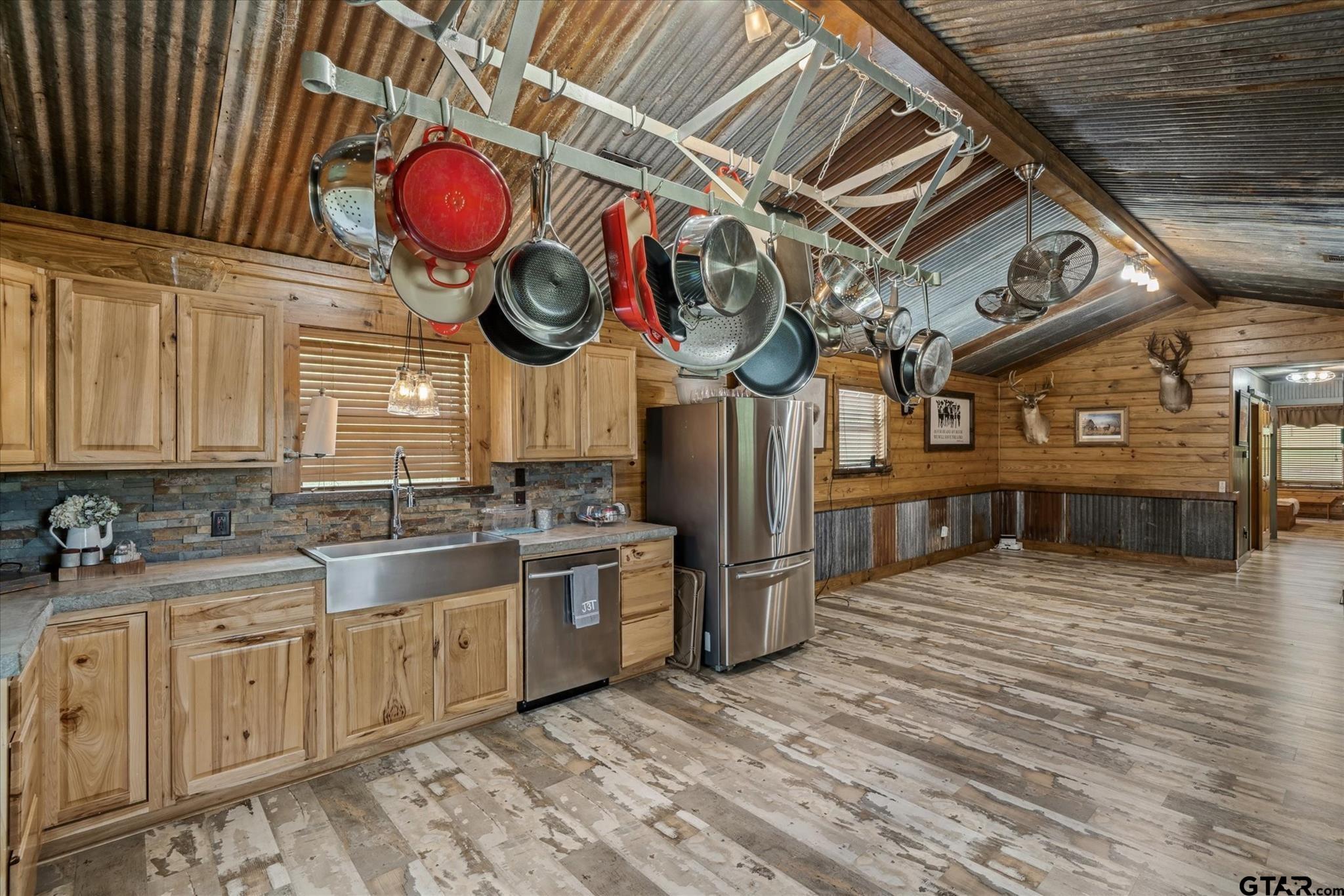 902 County Road 3710 Edgewood, TX 75117 - Photo 31 of 41 a kitchen with stainless steel appliances granite countertop a sink and cabinets