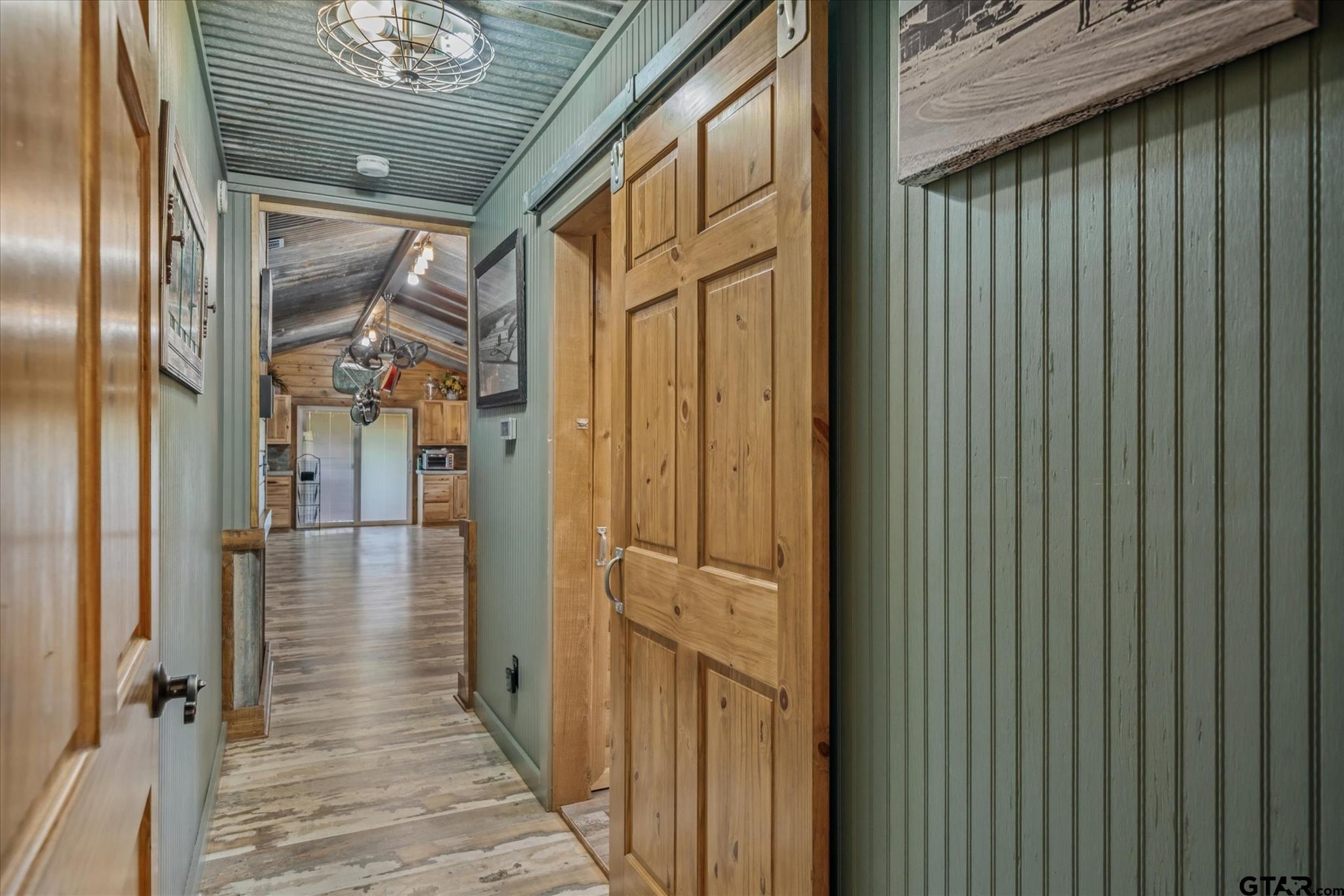 902 County Road 3710 Edgewood, TX 75117 - Photo 33 of 41 a view of a porch with wooden floor and a gate