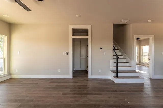 a view of entryway with wooden floor and stairs