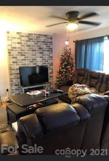 5015 Myers Road Monroe, NC 28110 - Photo 2 of 5 a living room with furniture and a fireplace