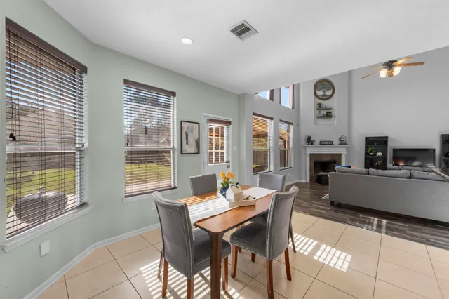 a view of a dining room with furniture window and outside view