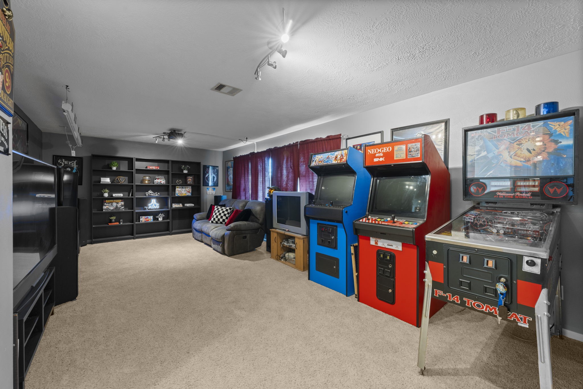 9011 Cedar Run Falls Tomball, TX 77375 - Photo 19 of 30 a view of a room with workspace and flat screen tv