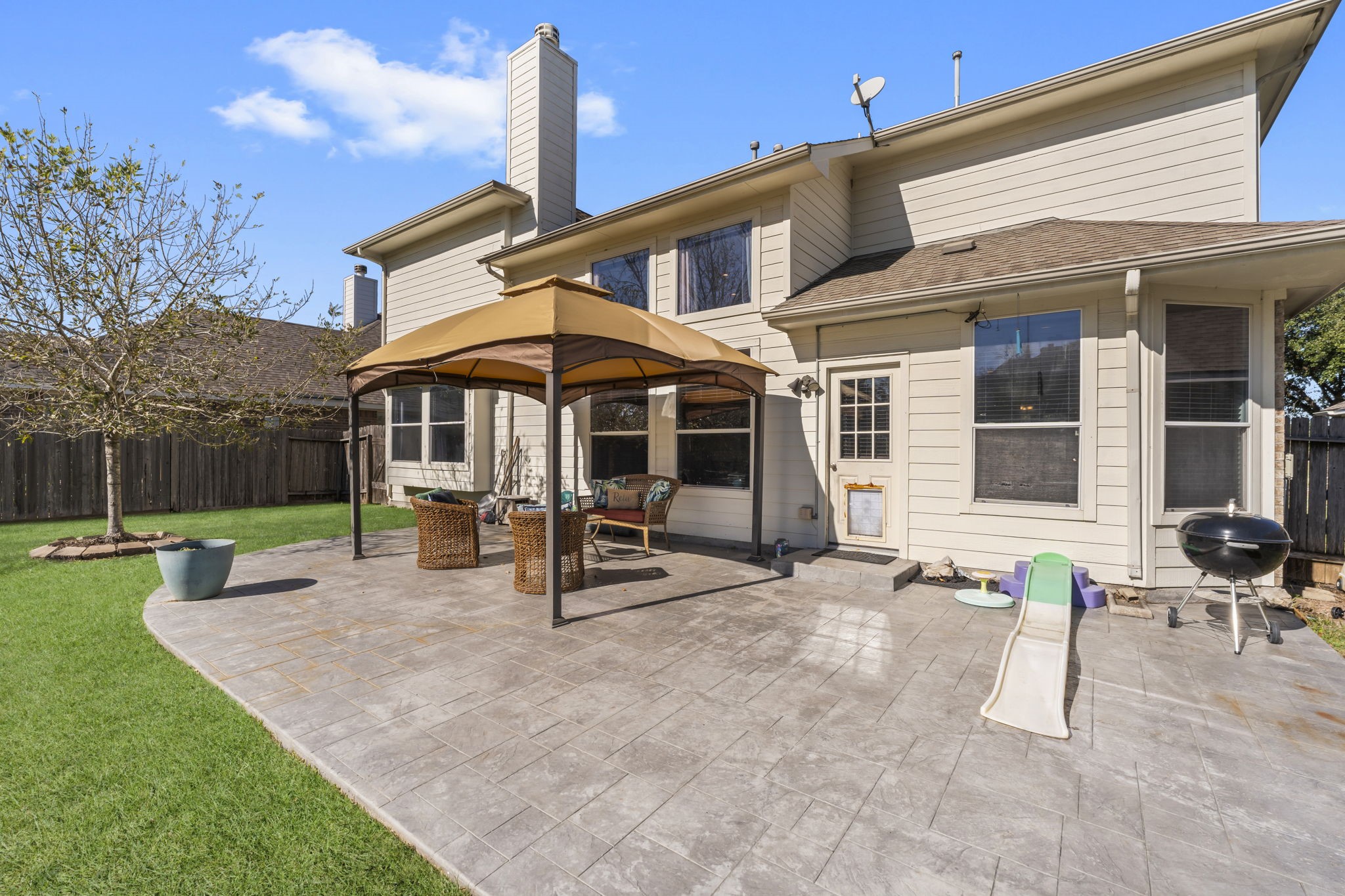 9011 Cedar Run Falls Tomball, TX 77375 - Photo 26 of 30 a view of a house with backyard porch and sitting area