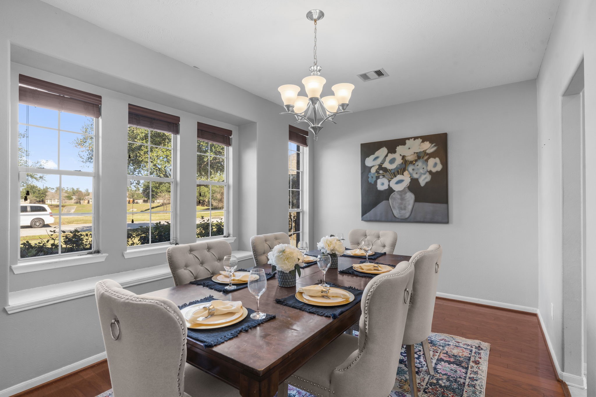 9011 Cedar Run Falls Tomball, TX 77375 - Photo 5 of 30 a view of a dining room with furniture a chandelier and wooden floor