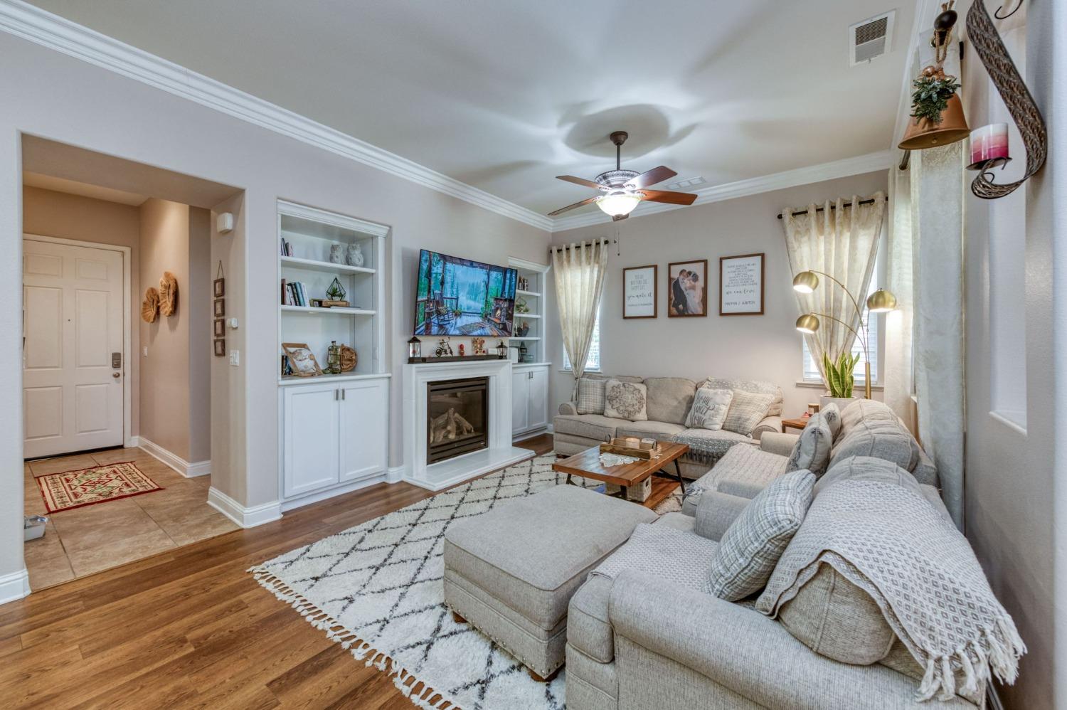 3275 Keats Avenue Clovis, CA 93619 - Photo 11 of 36 a living room with furniture and a fireplace