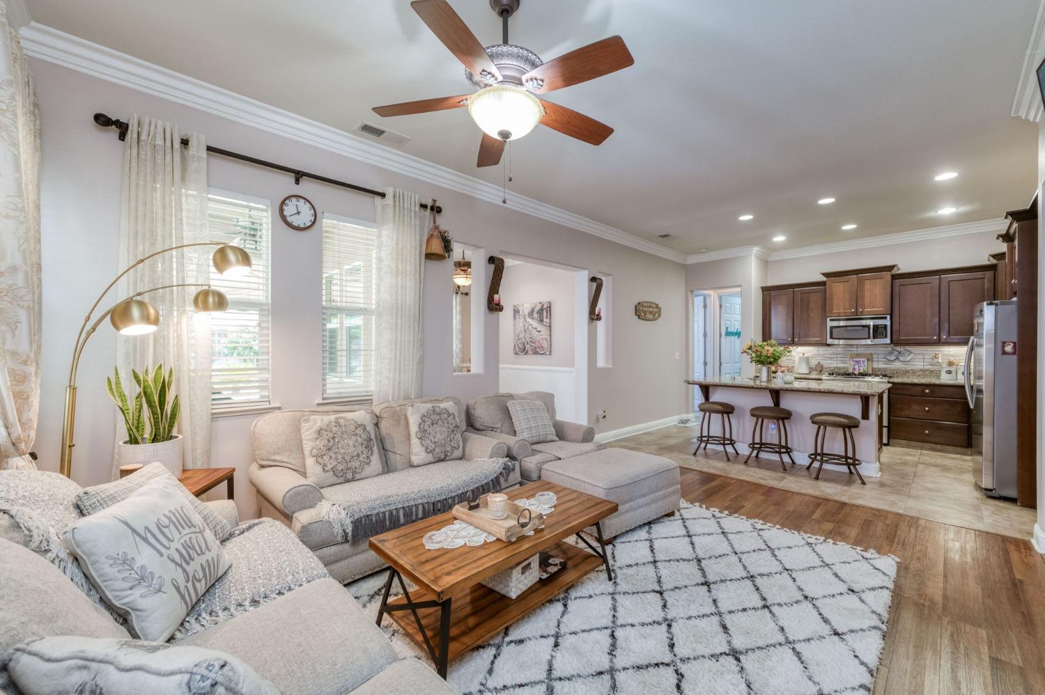 3275 Keats Avenue Clovis, CA 93619 - Photo 12 of 36 a living room with furniture kitchen view and a large window