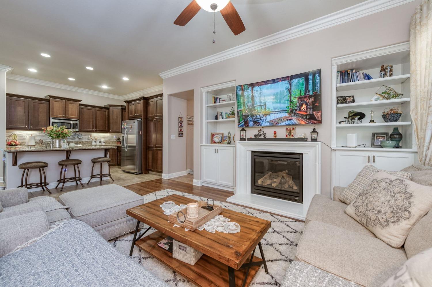 3275 Keats Avenue Clovis, CA 93619 - Photo 13 of 36 a living room with furniture and a fireplace