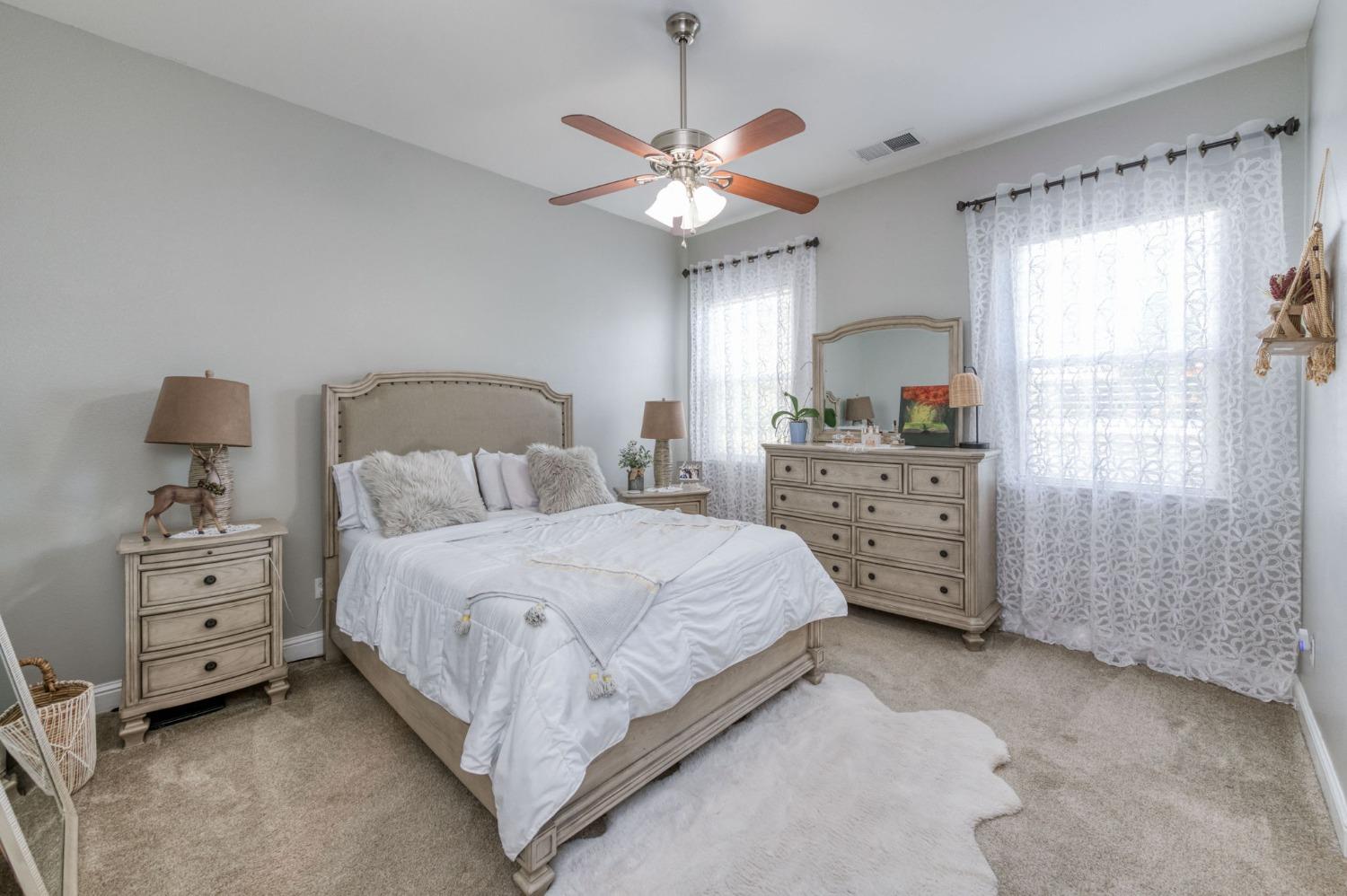 3275 Keats Avenue Clovis, CA 93619 - Photo 24 of 36 a bedroom with a bed dresser and a window