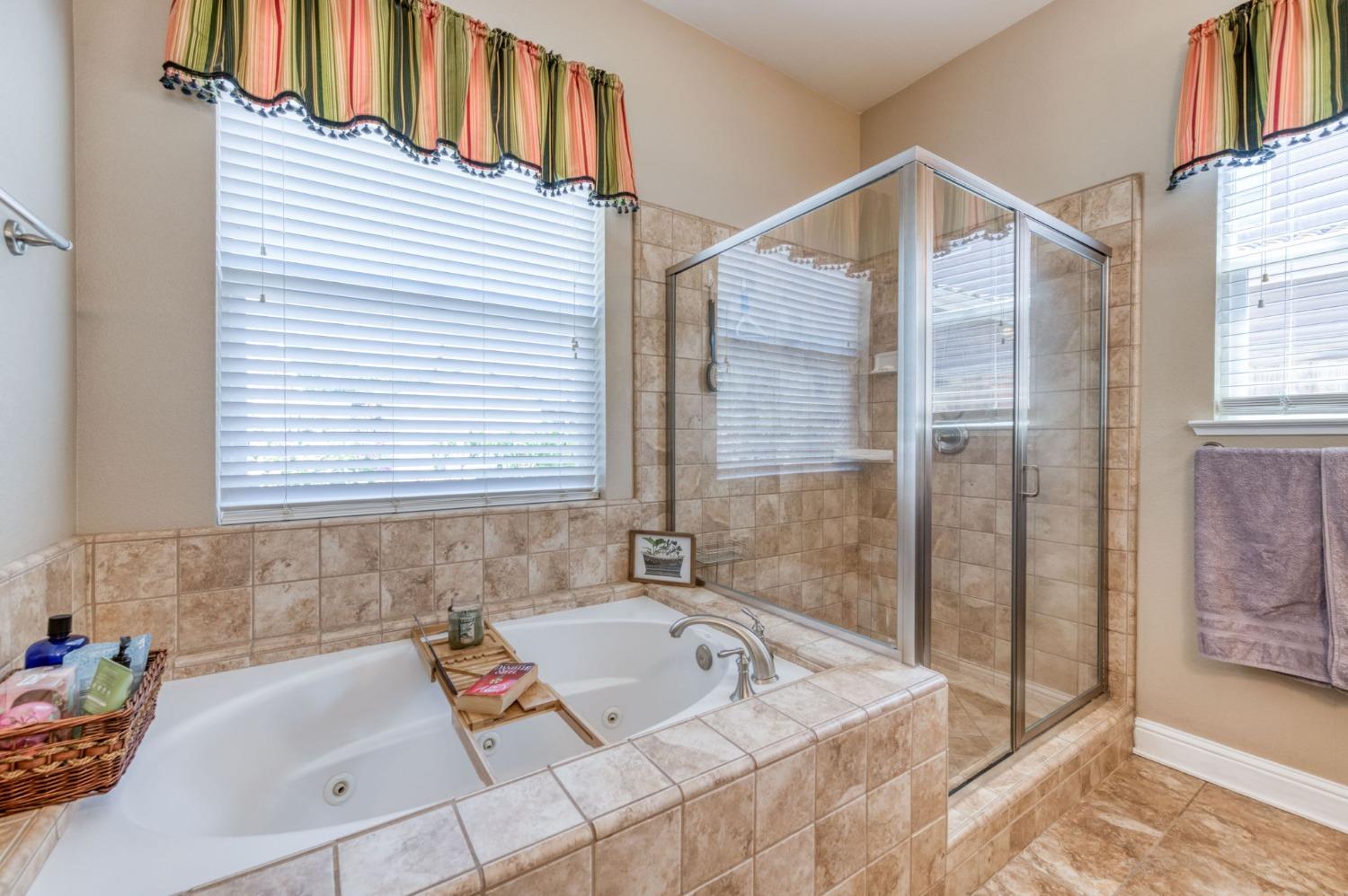 3275 Keats Avenue Clovis, CA 93619 - Photo 27 of 36 a bathroom with a tub sink and a shower