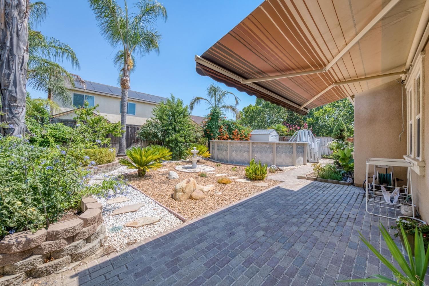 3275 Keats Avenue Clovis, CA 93619 - Photo 30 of 36 a view of a backyard with a patio