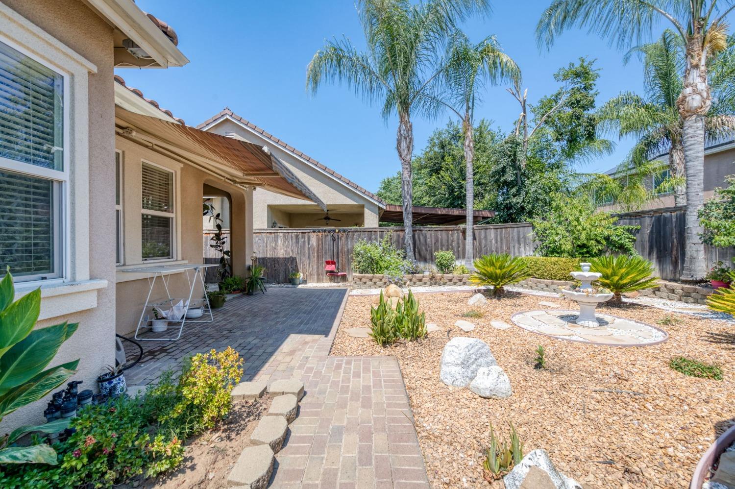 3275 Keats Avenue Clovis, CA 93619 - Photo 36 of 36 a front view of a house with garden and patio