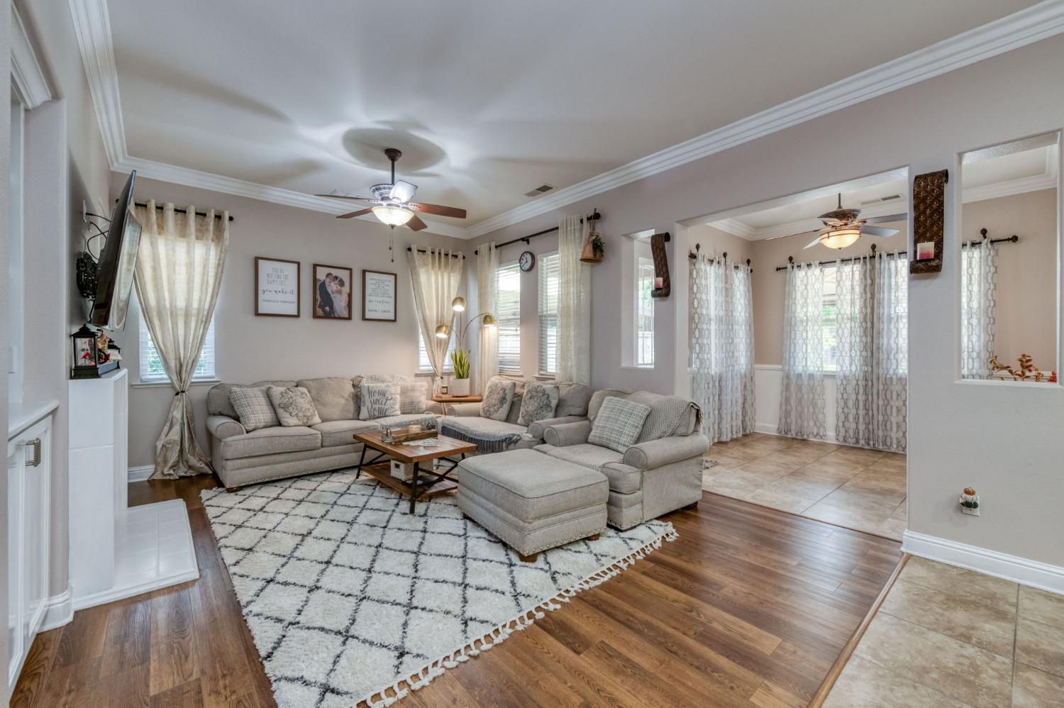 3275 Keats Avenue Clovis, CA 93619 - Photo 10 of 36 a living room with furniture and a chandelier
