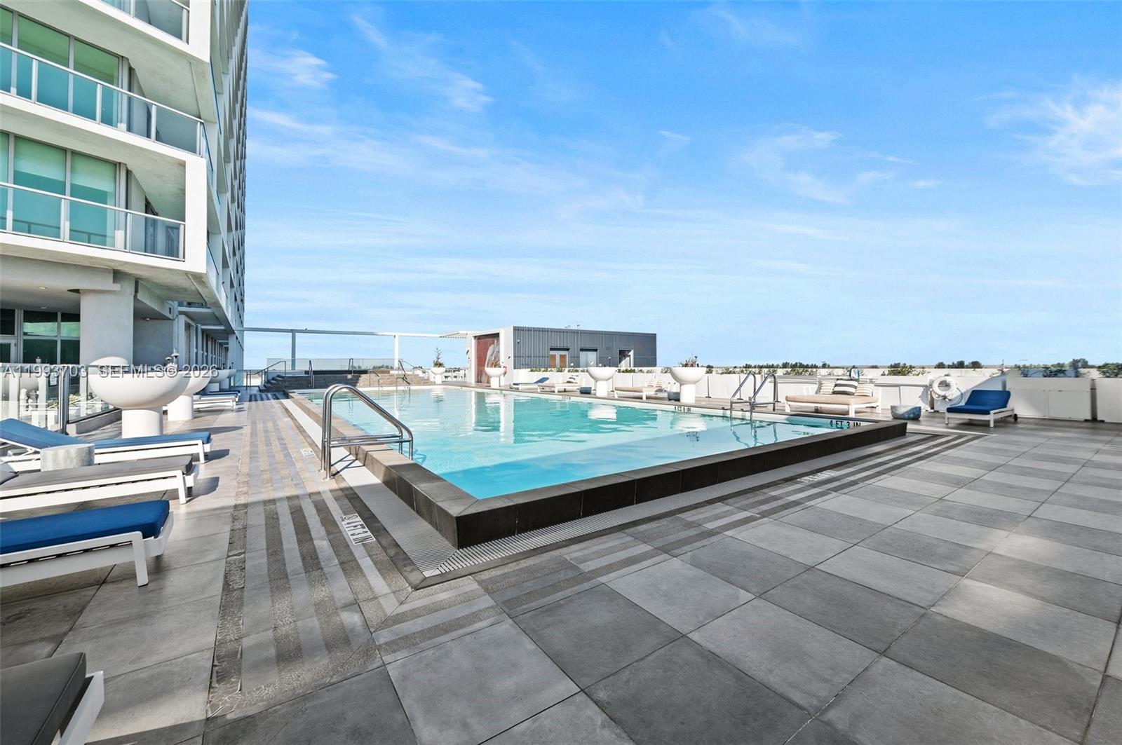 2000 Metropica Way, Unit 508 Sunrise, FL 33323 - Photo 15 of 25 a view of swimming pool with outdoor seating