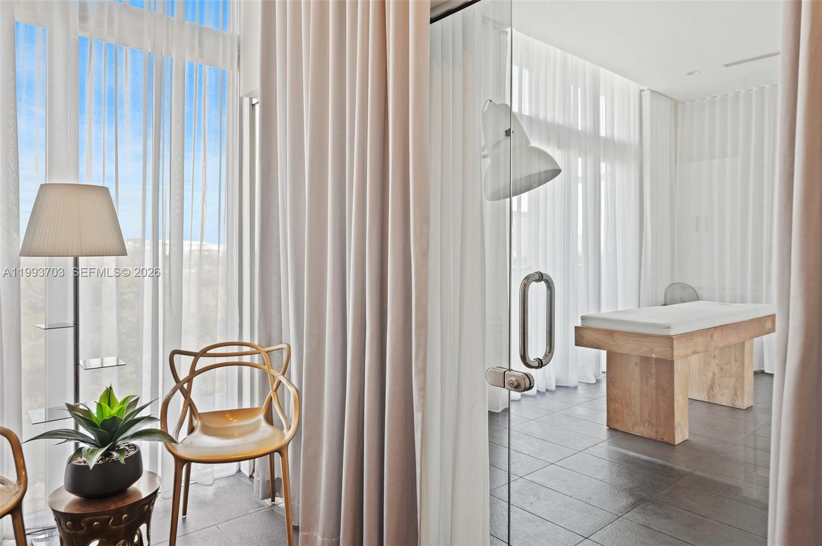 2000 Metropica Way, Unit 508 Sunrise, FL 33323 - Photo 20 of 25 a bathroom with shower a sink and a mirror